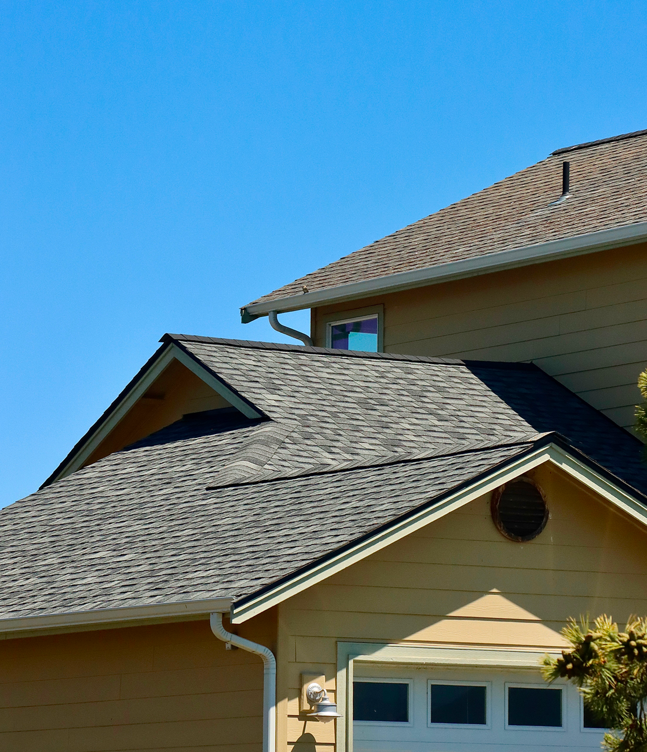 House roof against a clear blue sky.